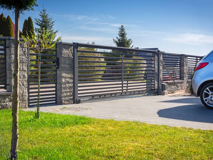 beautiful grey colored gate installed on a residential property.